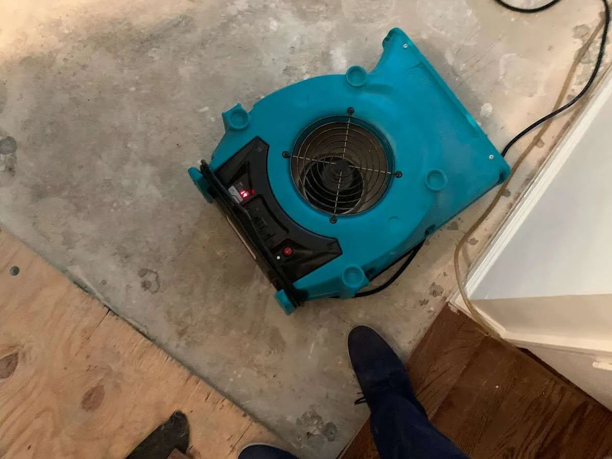 Air mover drying subfloor during Leak Detection & Repair in Lake Forest